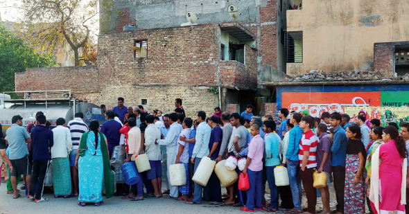 People lining up for water is a common sight in many Indian towns and cities, and the lines will get longer in days to come 