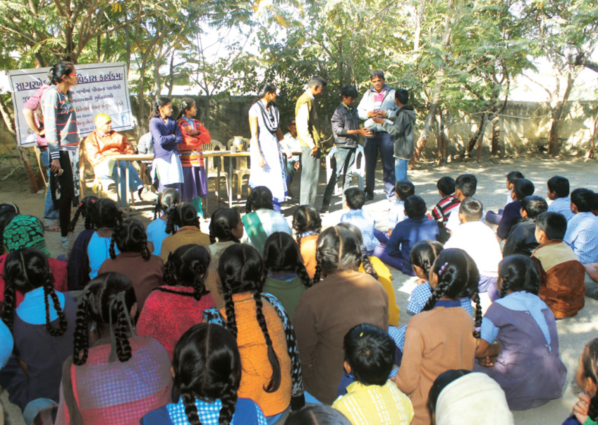 School kids get educated about water quality in a village in the Kodinar subdivision of Junagadh