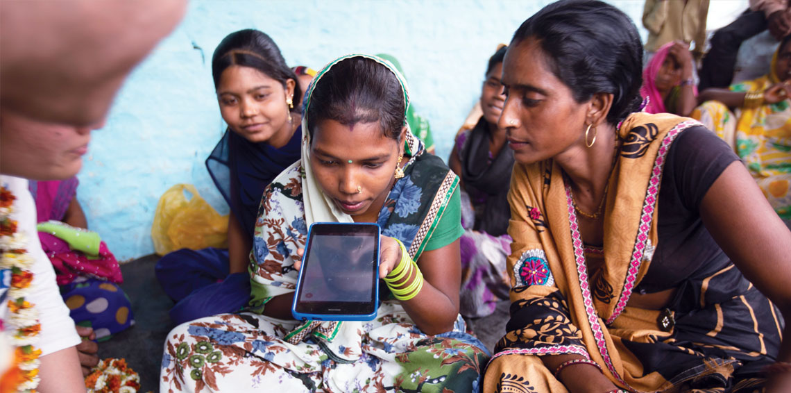 Internet saathi Usha (right) from Adampur village in Rajasthan's Dholpur district, with programme beneficiary Raja Beti 