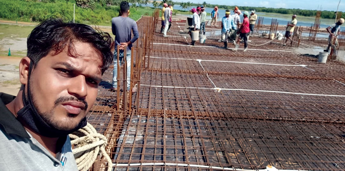 Ajit Mohanty, who operates an electrical and plumbing business, at a construction site near his village, Chatrapur, in Odisha's Ganjam district