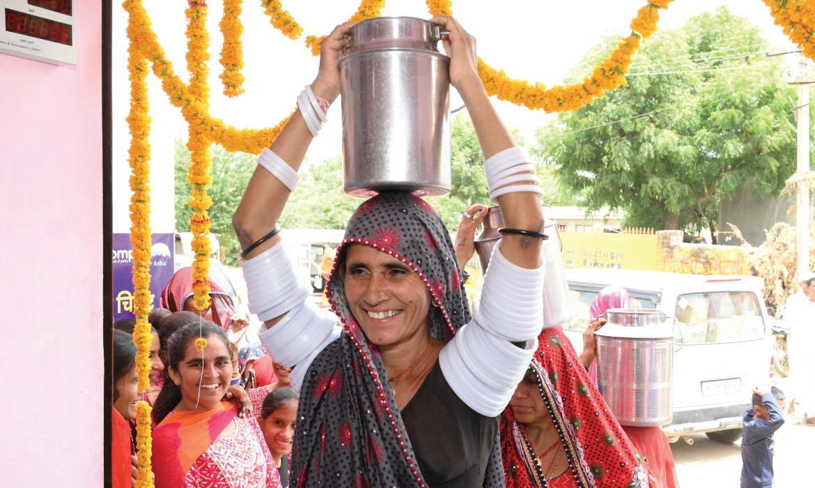 Sita Devi, a member of the Alwar MPC, brings her day’s collection to a centre with a newly-inaugurated milk chiller unit in Sheoganj in Rajasthan