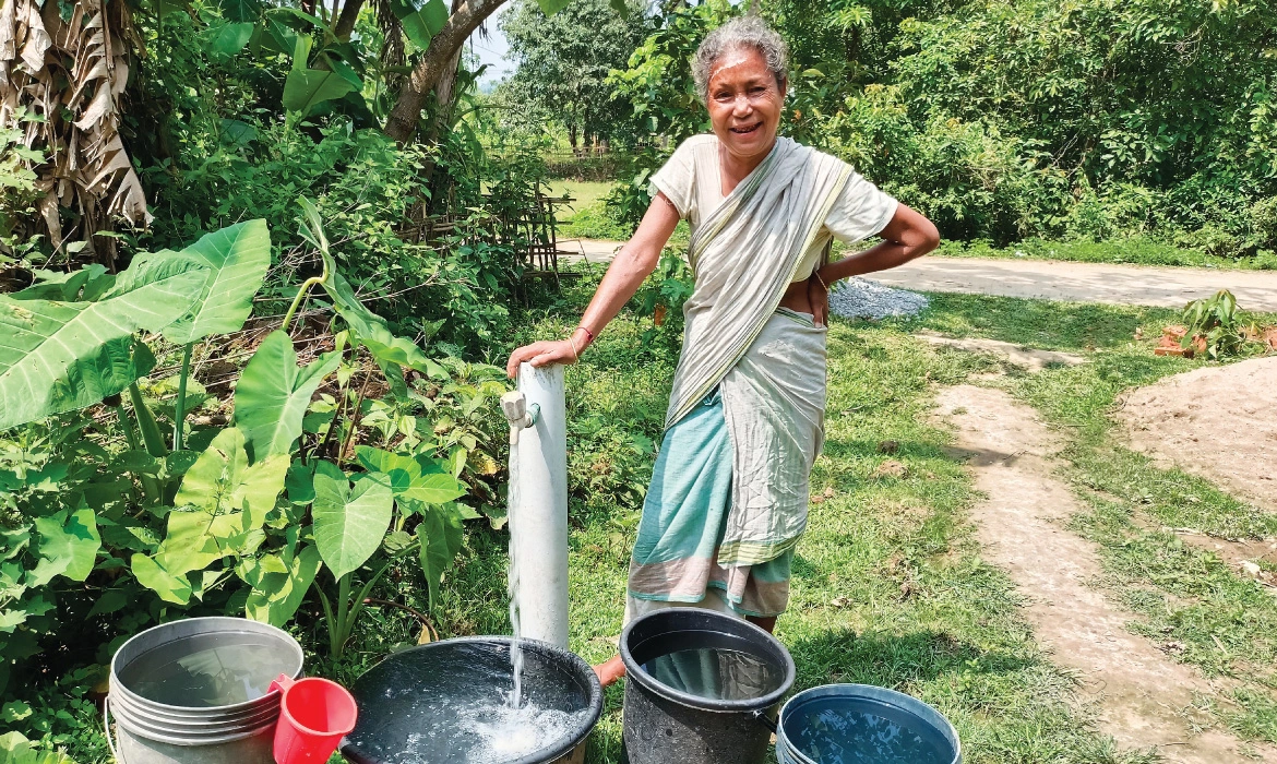 Durbala Boro collects water from the tap installed near her home in Choudhurypara in the Kamrup Rural district of Assam. 