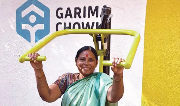 A sanitation worker at the model chowki, which has exercise equipment
