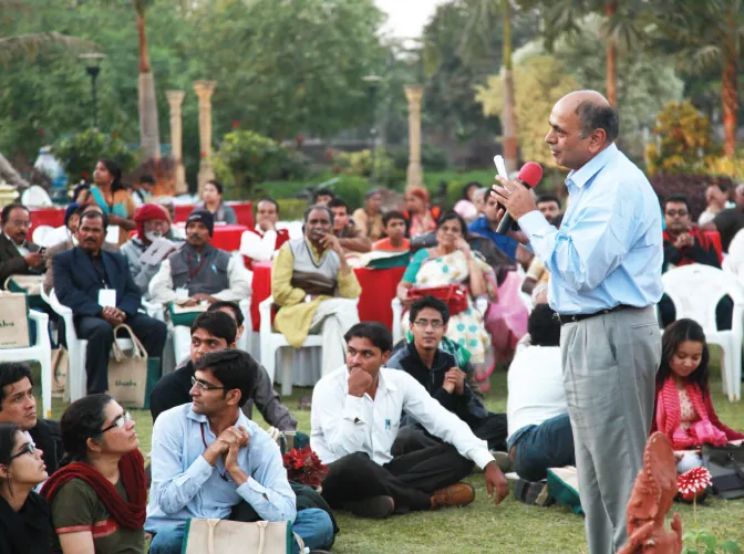 In this image from 2012, Prof Devy speaks to a group of people about India’s oral heritage