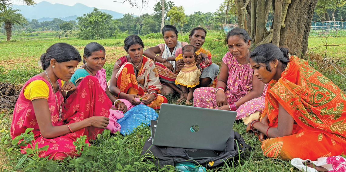 Women farmers from Kudwa village in the Dhanbad district of Jharkhand watch an educational film about menstrual health and hygiene