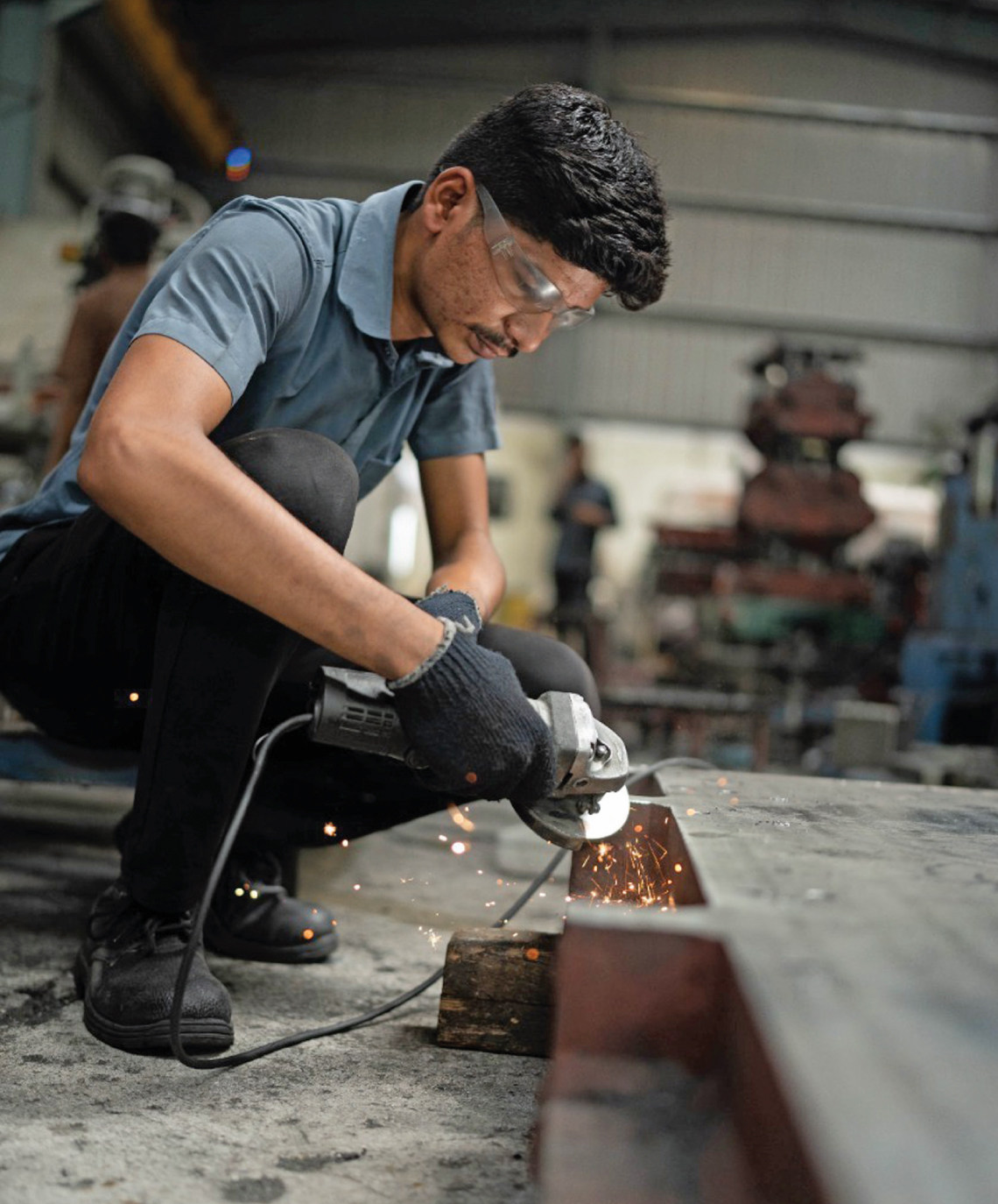 Tushar Awhad, a trainee from the Chatrapati Sambhaji Nagar ITI in Maharashtra, during his on-the-job training course at a factory