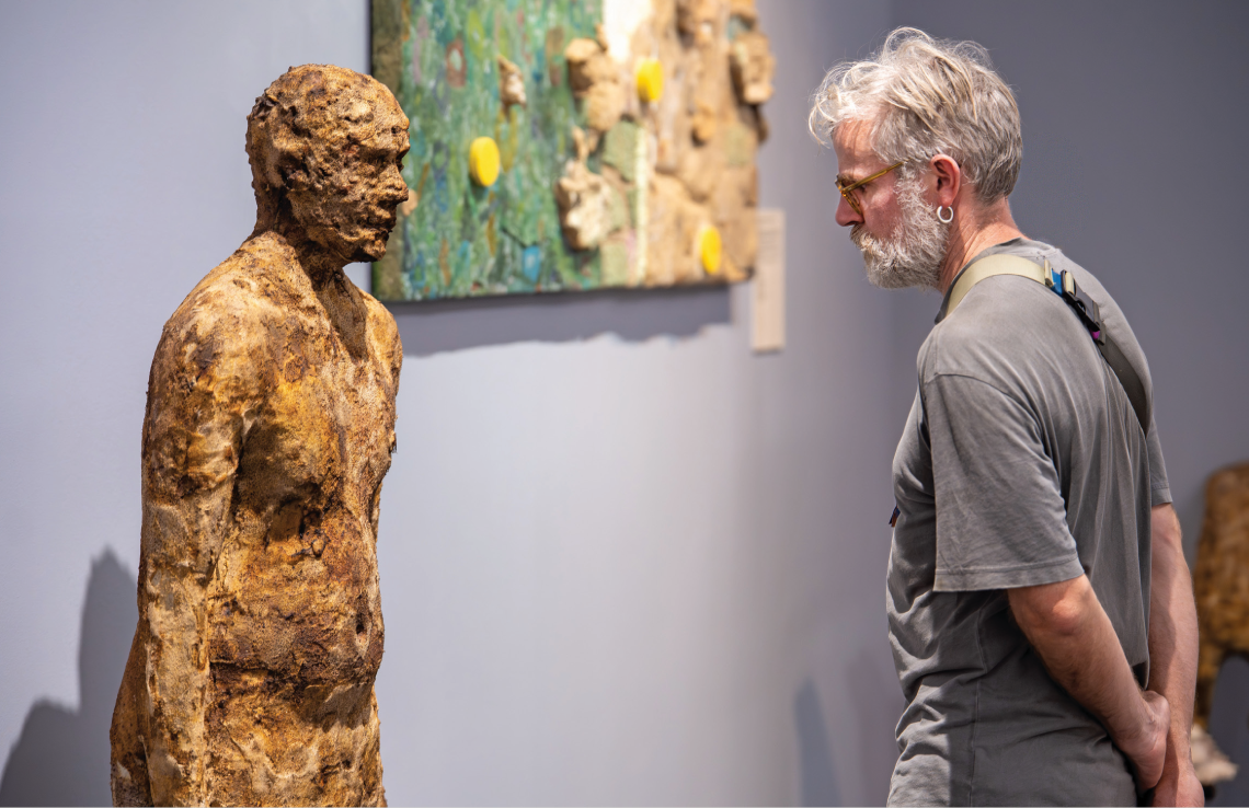 A visitor goes face-to-face at the Students’ Biennale 