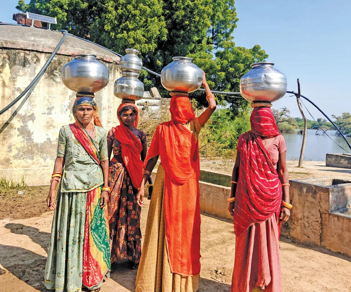 Villagers fetch water for domestic use from the ground-level reservoir in Gogra village in the Pali district of Rajasthan